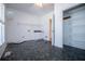 Well-lit laundry room with shelves and modern appliances at 111 Dixson Rd, Bowdon, GA 30108