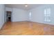 Bright living room with hardwood flooring, crown moulding, and natural light at 111 Dixson Rd, Bowdon, GA 30108