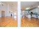 Open concept living and kitchen area, hardwood floors, and bright natural light at 111 Dixson Rd, Bowdon, GA 30108