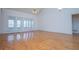 Spacious living room features hardwood flooring and large windows at 111 Dixson Rd, Bowdon, GA 30108