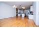 Spacious living room features hardwood floors, neutral paint and kitchen in the background at 111 Dixson Rd, Bowdon, GA 30108