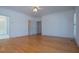 Bright bedroom with hardwood flooring, ceiling fan, and access to the bathroom at 111 Dixson Rd, Bowdon, GA 30108