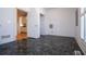 Room with built-in shelves and black marbled floors at 111 Dixson Rd, Bowdon, GA 30108
