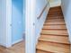 Wooden staircase leading to the second floor at 111 Dixson Rd, Bowdon, GA 30108