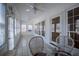 Sunroom showcases tile flooring, bright windows, ceiling fans, and cozy seating perfect for relaxation at 111 Dixson Rd, Bowdon, GA 30108