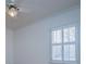 Bedroom window with white trim and crown molding on the ceiling at 111 Dixson Rd, Bowdon, GA 30108