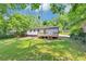 Large grassy backyard with deck and mature landscaping at 2317 Baywood Se Dr, Atlanta, GA 30315