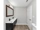 Bathroom with double vanity, framed mirror and modern fixtures at 2317 Baywood Se Dr, Atlanta, GA 30315