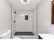 Bathroom featuring tile walk-in shower with a modern shower head fixture at 2317 Baywood Se Dr, Atlanta, GA 30315
