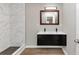 Modern bathroom with black double vanity, a framed mirror and tile shower at 2317 Baywood Se Dr, Atlanta, GA 30315