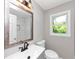 Stylish bathroom featuring a modern vanity, updated fixtures, and a marble-tiled shower at 2317 Baywood Se Dr, Atlanta, GA 30315