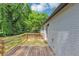 Wooden deck with railings offers a great view of backyard and greenery at 2317 Baywood Se Dr, Atlanta, GA 30315