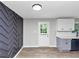 Modern kitchen with wood flooring and decorative gray paneled wall at 2317 Baywood Se Dr, Atlanta, GA 30315