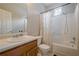 Bright bathroom features a shower-tub combination, updated vanity and a large mirror at 331 Windcroft Nw Ln, Acworth, GA 30101