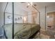Cozy bedroom boasts a four-poster bed and ensuite bathroom for convenient living at 331 Windcroft Nw Ln, Acworth, GA 30101