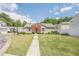 Beautiful single-story home with gray siding, red brick front, a green lawn and walkway at 331 Windcroft Nw Ln, Acworth, GA 30101