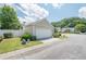 Attached two-car garage with a white door and neat landscaping enhancing curb appeal at 331 Windcroft Nw Ln, Acworth, GA 30101
