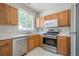 Functional kitchen featuring stainless steel appliances and light colored cabinets at 331 Windcroft Nw Ln, Acworth, GA 30101