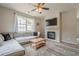 Comfortable living room featuring a fireplace, ceiling fan, and large sectional sofa at 331 Windcroft Nw Ln, Acworth, GA 30101