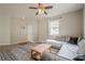Comfortable living room with light gray walls, a sectional sofa, and a rug at 331 Windcroft Nw Ln, Acworth, GA 30101