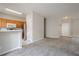 Spacious living space with an open view of the kitchen, breakfast bar and door at 331 Windcroft Nw Ln, Acworth, GA 30101