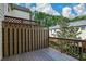The outdoor wooden deck features a privacy fence with both vertical slats and decorative lattice at 3692 Lambert Ne Ln, Brookhaven, GA 30319