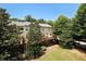 Beautiful backyard featuring mature trees, lush lawn, and a spacious deck at 3692 Lambert Ne Ln, Brookhaven, GA 30319
