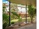 Covered patio with view of backyard lawn, fence, and second story wooden decks at 3692 Lambert Ne Ln, Brookhaven, GA 30319