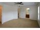 A large, carpeted bedroom boasts natural light from the windows, providing a comfortable and inviting space at 3692 Lambert Ne Ln, Brookhaven, GA 30319