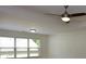 Bright bedroom featuring a ceiling fan and a large window that provides ample natural light at 3692 Lambert Ne Ln, Brookhaven, GA 30319