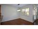 Bright dining room features hardwood floors and natural light from a large window at 3692 Lambert Ne Ln, Brookhaven, GA 30319
