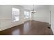 Elegant dining room with hardwood floors, crown molding, and large windows for natural light at 3692 Lambert Ne Ln, Brookhaven, GA 30319
