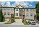 Attractive brick townhome with well-maintained landscaping, garage, and a welcoming entrance at 3692 Lambert Ne Ln, Brookhaven, GA 30319