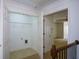 A conveniently located open closet with wire shelving and laundry connections is next to a hallway with a bedroom beyond at 3692 Lambert Ne Ln, Brookhaven, GA 30319