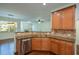 Stylish kitchen featuring stainless steel appliances, granite countertops, and ample cabinet space at 3692 Lambert Ne Ln, Brookhaven, GA 30319
