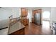 Modern kitchen featuring granite countertops, stainless steel appliances, and hardwood flooring at 3692 Lambert Ne Ln, Brookhaven, GA 30319