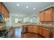 Well-appointed kitchen with stainless steel appliances, granite countertops, and wooden cabinets at 3692 Lambert Ne Ln, Brookhaven, GA 30319