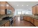 Bright kitchen with stainless steel appliances, granite countertops, and hardwood flooring at 3692 Lambert Ne Ln, Brookhaven, GA 30319