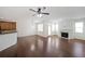 Spacious living area with fireplace, hardwood floors, and open access to the kitchen at 3692 Lambert Ne Ln, Brookhaven, GA 30319