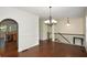 Spacious living room features hardwood floors, elegant lighting, and an open floor plan at 3692 Lambert Ne Ln, Brookhaven, GA 30319