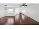 Bright living room featuring hardwood floors, a fireplace, recessed lighting and large windows at 3692 Lambert Ne Ln, Brookhaven, GA 30319