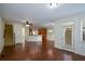 Open-concept living area with hardwood floors connecting to the kitchen and staircase at 3692 Lambert Ne Ln, Brookhaven, GA 30319