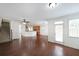 Open-concept space with hardwood floors, seamlessly connecting the living, dining, and kitchen areas at 3692 Lambert Ne Ln, Brookhaven, GA 30319