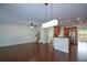 Open living space featuring hardwood floors, modern lighting, and a connection to the kitchen at 3692 Lambert Ne Ln, Brookhaven, GA 30319