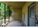 Covered back porch with concrete floor and exterior access door to the home at 3692 Lambert Ne Ln, Brookhaven, GA 30319