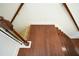 An open staircase with dark wooden treads and railings leads to the upper level of this home at 3692 Lambert Ne Ln, Brookhaven, GA 30319