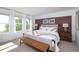 Cozy bedroom featuring multiple windows for natural light, paired with stylish decor and wooden accents at 5108 Arista Dr, Douglasville, GA 30135