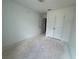 A spacious bedroom with unfinished flooring, closet, and neutral walls, ready for customization at 5108 Arista Dr, Douglasville, GA 30135