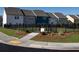 Landscaped common area within a new community includes sidewalks and manicured landscaping at 5108 Arista Dr, Douglasville, GA 30135
