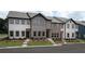 New townhomes displaying multiple designs and colors with professionally landscaped yards at 5108 Arista Dr, Douglasville, GA 30135